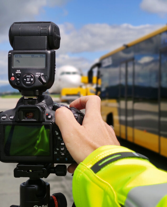 Camera in front of bus and aeroplane