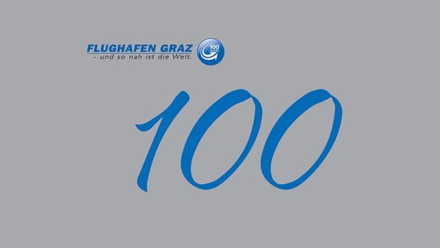 100er und Logo auf grauem Hintergrund.
